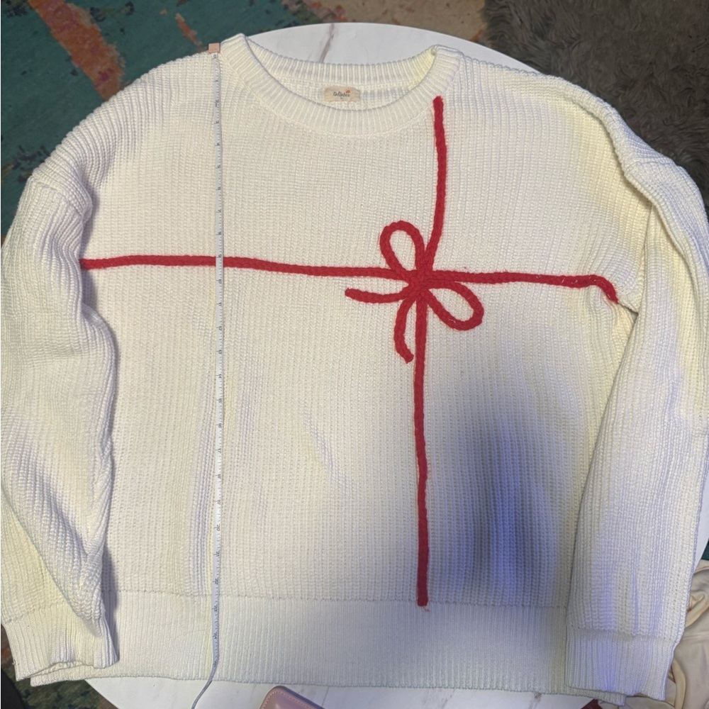 Cozy Cream Sweater with Red Bow Accent